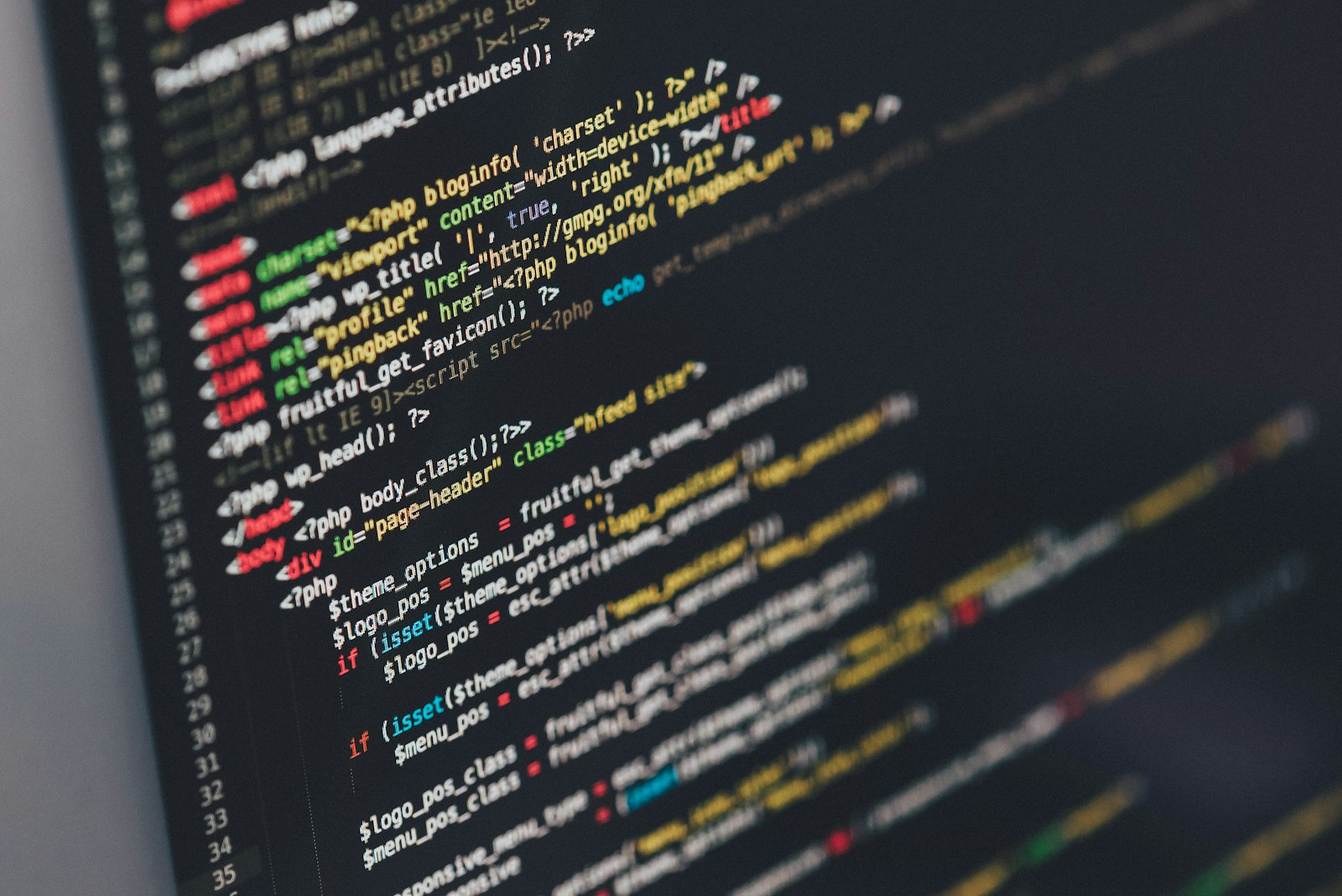Person coding a website on a desktop
