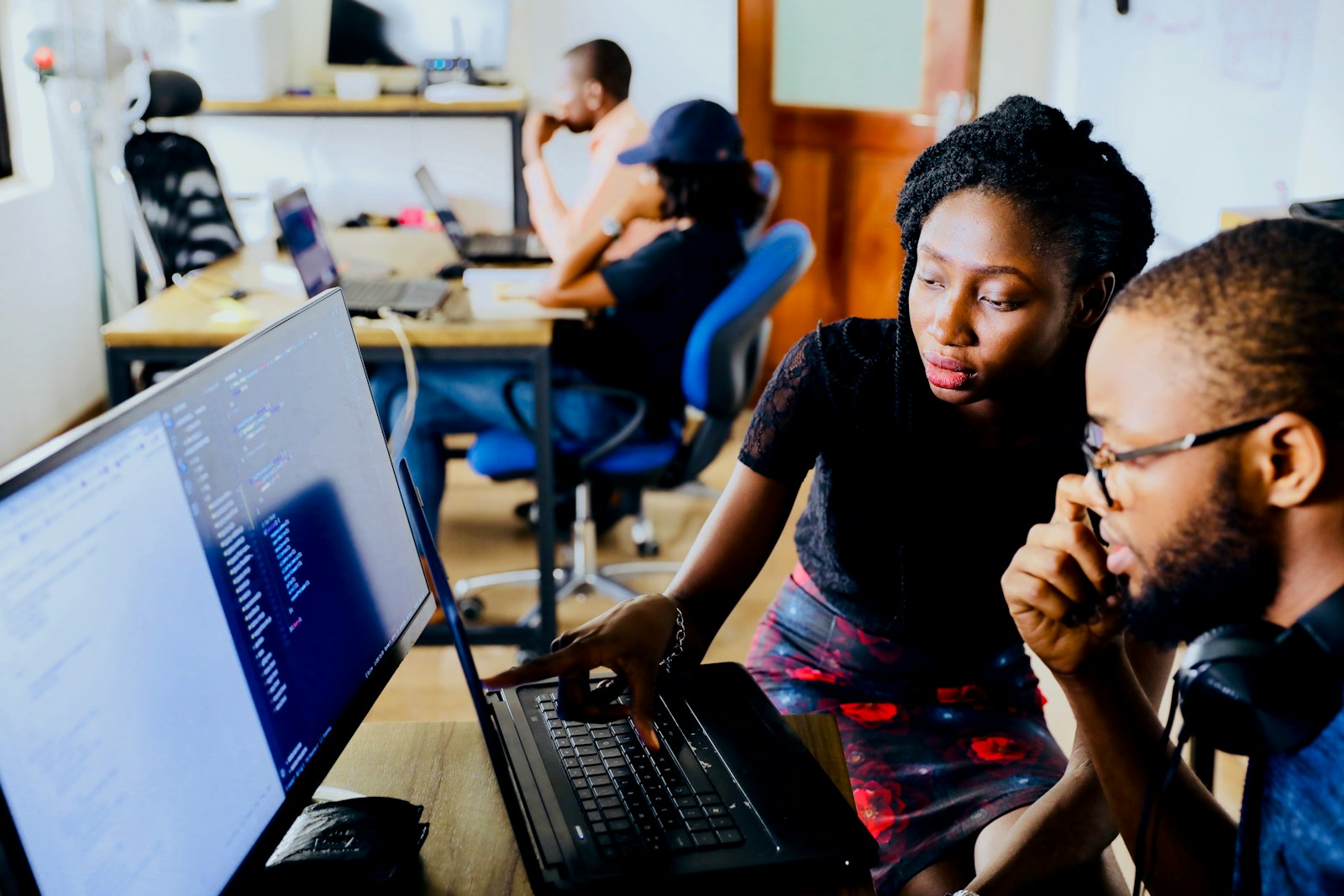 Students learning practical tech skills together